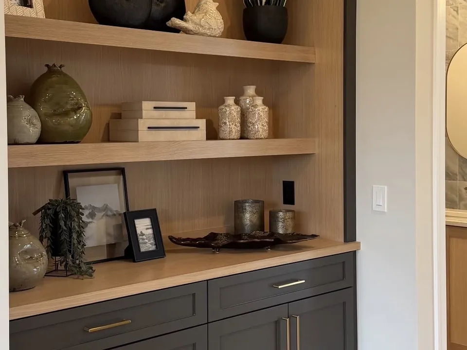 Oak built-in shelving with black base cabinet