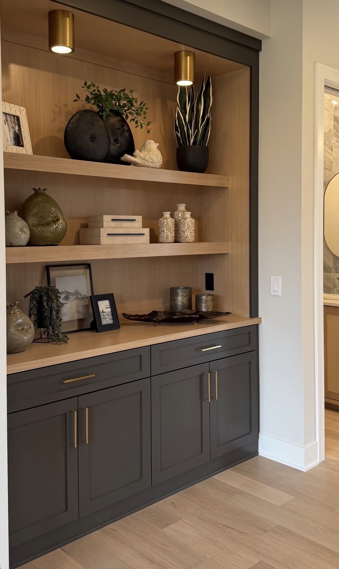 Oak built-in shelving with black base cabinet