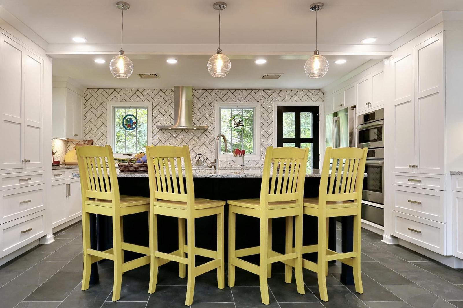 Remodeled kitchen island with pendant lights