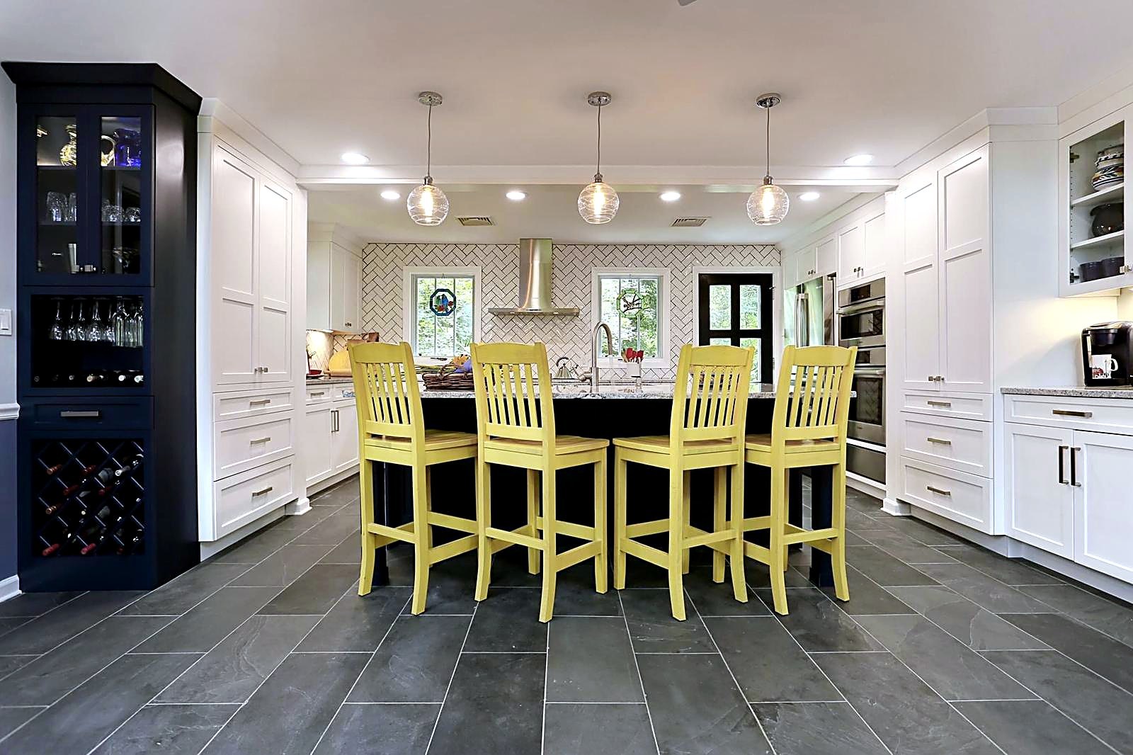 Wide establishing view of the kitchen island, wine cabinet and coffee nook together