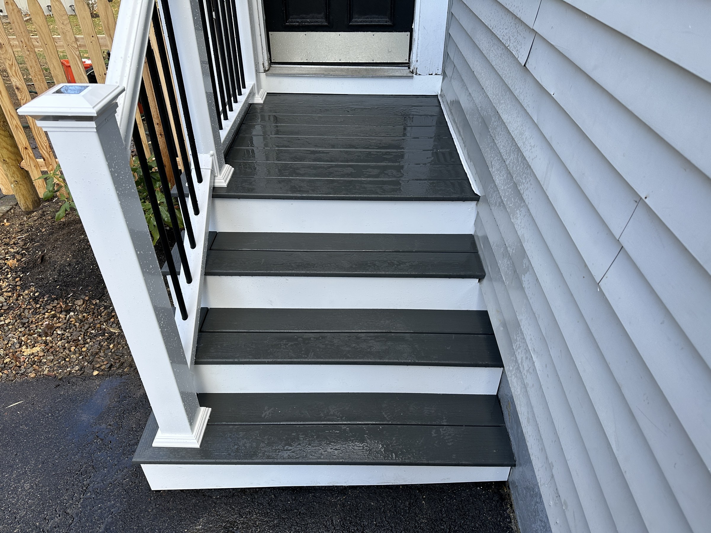 Close detail of the composite treads and a solar-cap newel post light, Reading