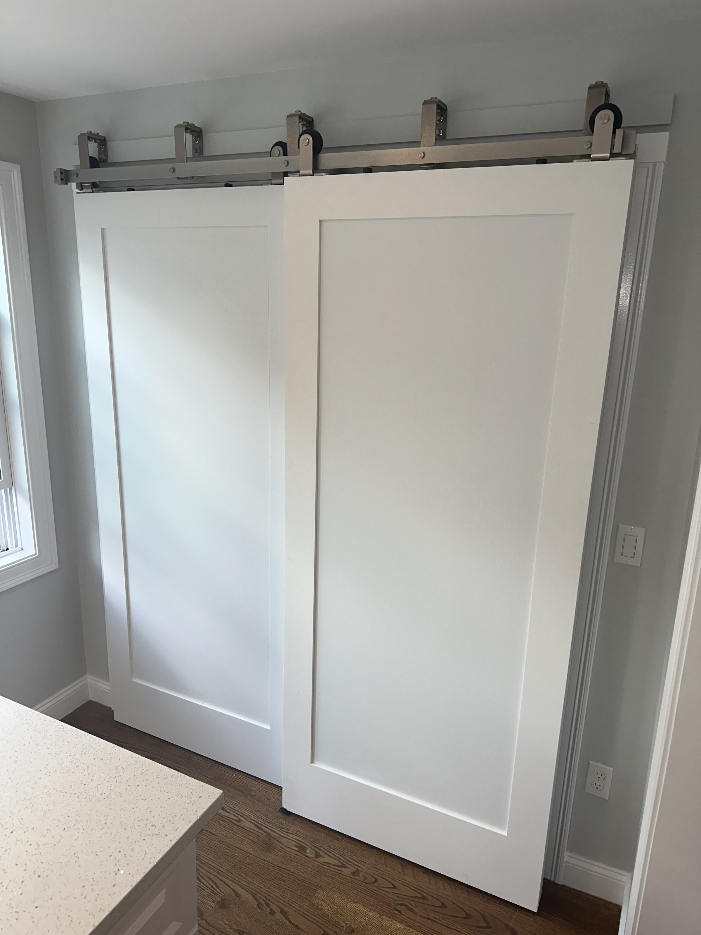 White double barn-door system on a nickel rail, Stoneham
