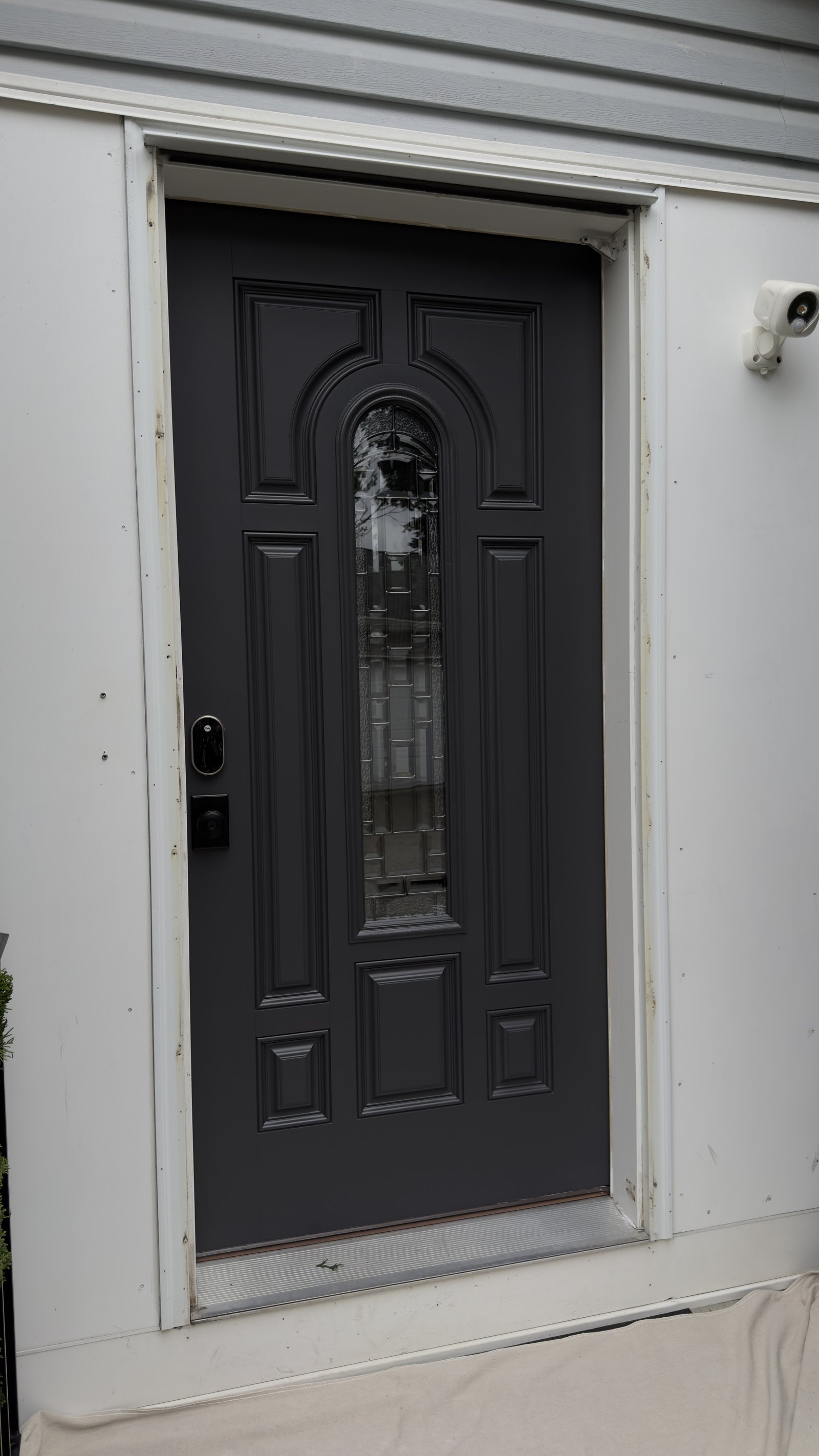 Existing front entry before replacement, straight-on view