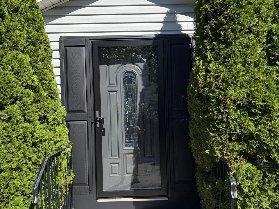 Finished black front entry with storm door and raised side panels, Peabody